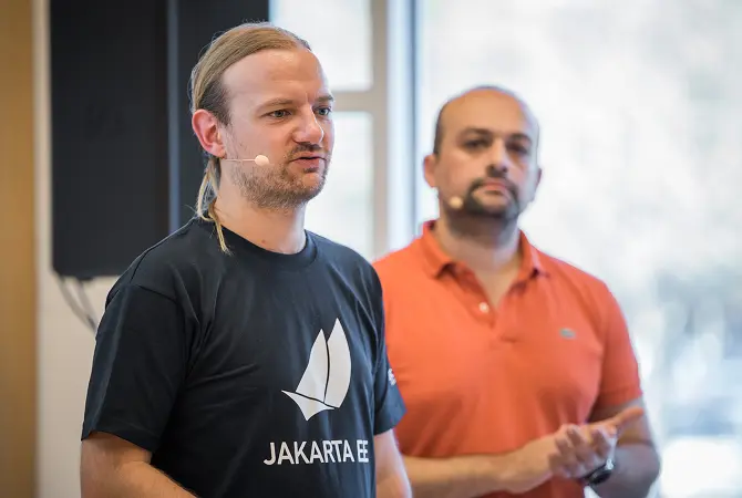 speakers presenting on stage at an event